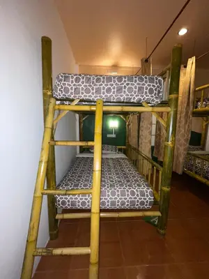 a couple of bunk beds in a room at Passion Nai Harn Guesthouse in Nai Harn Beach