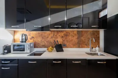 a kitchen with a sink and a microwave at Sunny Day Dream Villa - Nai Yang Beach in Thalang