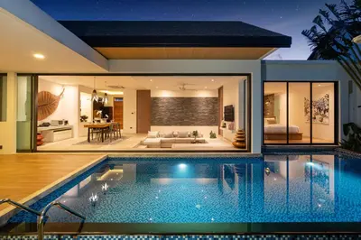a swimming pool in a house with a living room at Sunny Day Dream Villa - Nai Yang Beach in Thalang