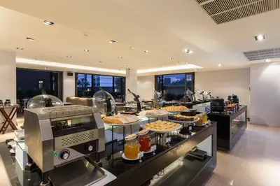 a kitchen with some food on a counter at The Charm Resort Phuket in Patong Beach