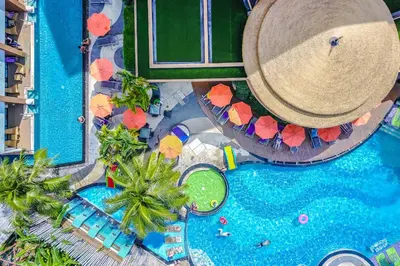 an overhead view of a pool at a resort at The Beach Heights Resort SHA Plus in Kata Beach
