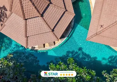 an overhead view of a resort swimming pool at Quality Beach Resorts and Spa Patong in Patong Beach