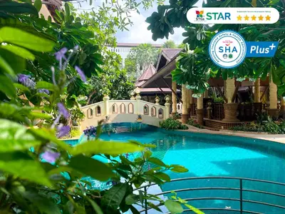 a swimming pool at the star resort and spa at Quality Beach Resorts and Spa Patong in Patong Beach