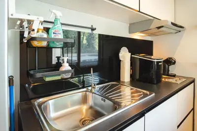 a kitchen with a sink and a counter top at Private apartment at Bayshore by Lofty in Patong Beach