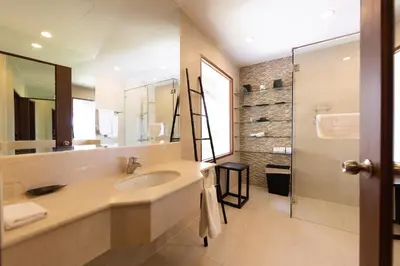 a bathroom with a sink and a mirror and a shower at Laguna Links Golf View Villa- Bangtao Beach in Phuket Town
