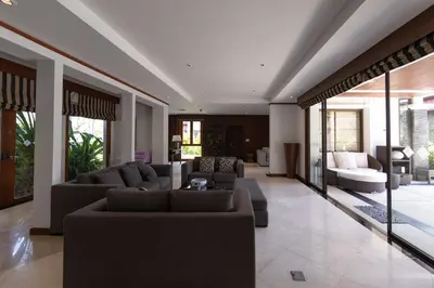 a living room with couches and a couch at Laguna Links Golf View Villa- Bangtao Beach in Phuket Town