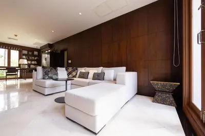 a living room with two white couches and a table at Laguna Links Golf View Villa- Bangtao Beach in Phuket Town