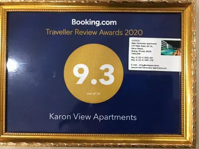 a framed picture of a ticket for the kennex view apartments at Karon View Apartments in Karon Beach