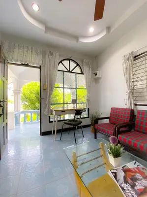 a living room with a couch and a table at Karon House 15B in Karon Beach