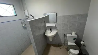 a bathroom with a toilet and a sink at Karon House 15B in Karon Beach