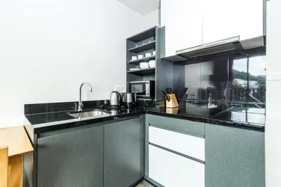 a kitchen with a sink and a counter top at The Deck patong Luxury Apartments The Deck patong in Patong Beach