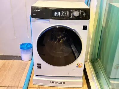 a washing machine sitting on top of a washer at Phuket Condominium Karon beach in Karon Beach