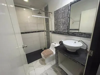 a bathroom with a sink and a toilet and a shower at PP Midnight Hotel in Phi Phi Don