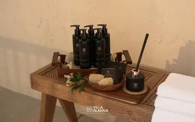 a wooden tray with a group of candles on a table at Villa Alanna Phuket in Bang Tao Beach