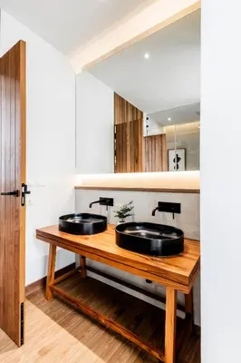 two sinks on a wooden table in a bathroom at Mono Oxygen Modern Pool Villas- Bangtao Beach in Phuket Town