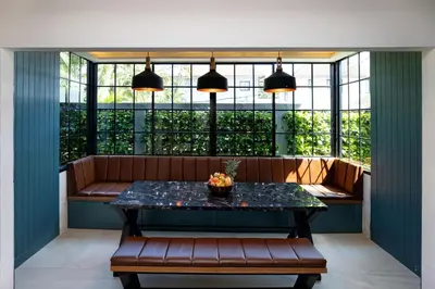 a table and bench in a room with a window at Best Holidays - Oxygen pool, Billard, Gym! 2-Storey Tropical Villa Havana N in Kamala Beach