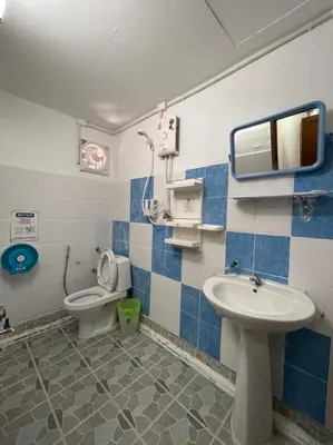 a bathroom with a toilet and a sink at Phi Phi Paradise Hostel in Phi Phi Don