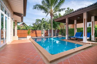 a swimming pool in the backyard of a house at Rawai Private Villas - Pools and Garden in Rawai Beach