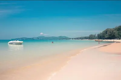 a boat in the water on a beach at The residence resort Villa 1bdr Private Pool in Phuket Town