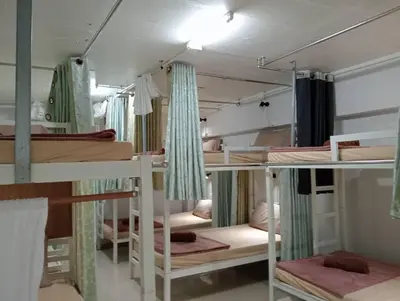 a room with a bunch of bunk beds at PhiPhi Film House in Phi Phi Don