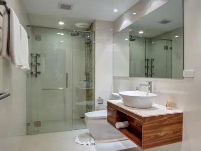 a bathroom with a toilet and a sink and a shower at The Title Rawai Beachfront (Sea paradise) in Rawai Beach