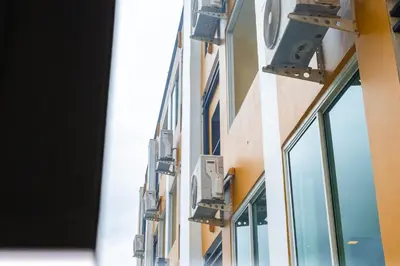 a facade of a building with windows at The Cheetar Hotel in Amphoe Kathu