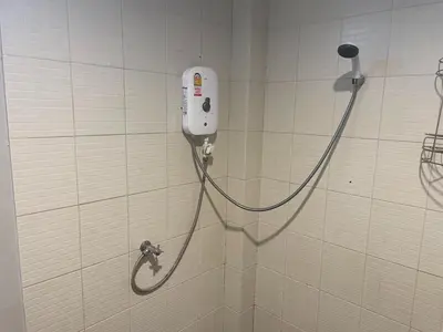 a shower in the wall of a bathroom at Naiyang Boutique Resort in Ban Phak Chit