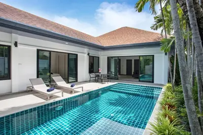 a swimming pool in the backyard of a villa at Villa Elima. Lovely pool villa 2 bedrooms at Rawai in Rawai Beach