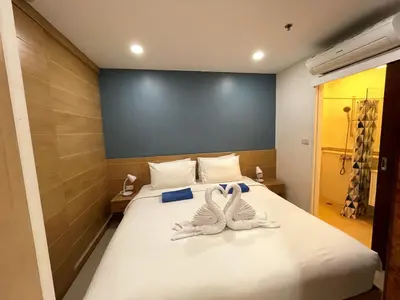 two towels on a bed in a room at Patong Tower apartment by Lofty in Patong Beach