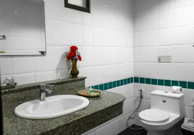 a bathroom with a sink and a toilet at Deng's kamala beach Guesthouse in Kamala Beach