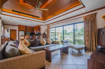 a living room with a couch and a table at Lotus Pool Villa Your Own Slice Of Island Paradise in Rawai Beach