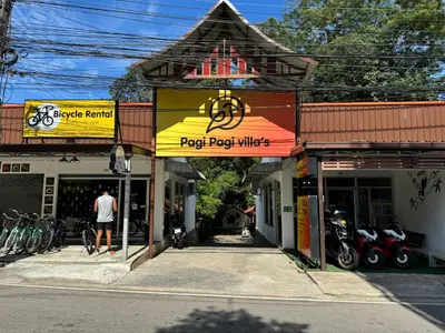 a man is standing in front of a shop at Pagi Pagi villas in Ao Nang Beach