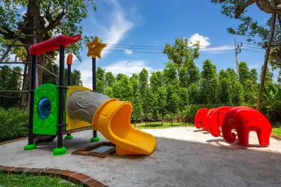a playground with colorful play equipment in a park at Title НайЯнг NaiYang in Nai Yang Beach