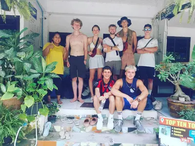 a group of people posing for a picture at Sweed Dee Hostel in Phi Phi Don