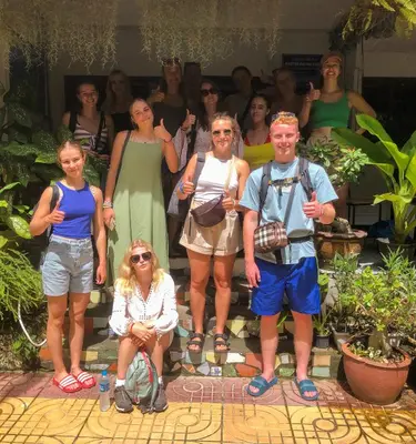 a group of people posing for a picture at Sweed Dee Hostel in Phi Phi Don