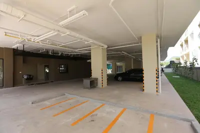 a parking garage with a car parked in it at Naka Residence in Phuket Town
