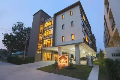 a large building with a sign in front of it at Naka Residence in Phuket Town