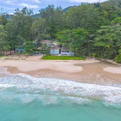 an aerial view of a beach with a house at Sealord Naithon Beachfront Villa in Nai Thon Beach