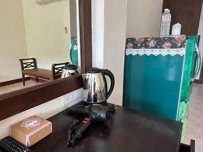 a kitchen counter with a blender on top of it at Kata Place Hotel in Kata Beach