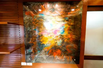 a close up of a painting on a wall at Luxurious large size swimming pool villa in Rawai in Ban Saiyuan (1)