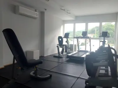 a gym with a row of chairs in a room at Kata Beach OZONE Superb Fully Equipped studio kitchen washing machine air con in Kata Beach