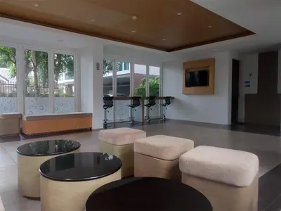 a living room with stools and a table and a piano at Kata Beach OZONE Superb Fully Equipped studio kitchen washing machine air con in Kata Beach