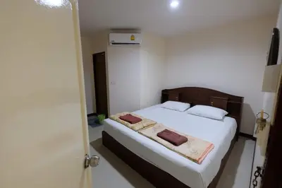 a bedroom with a bed with two towels on it at Phi Phi Blue Lagoon in Phi Phi Don