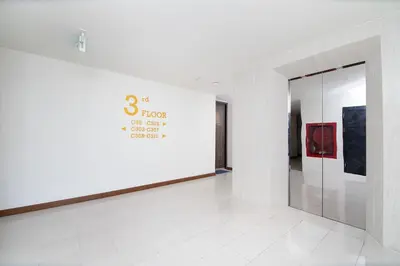a white room with a wall with a glass door at 2bdr Apartment near Surin beach PALM-C302 in Surin Beach