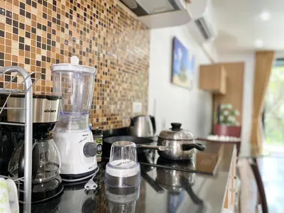 a kitchen counter with a blender on a stove at Patong - The Unity Seaview & Mountain Residence in Patong Beach