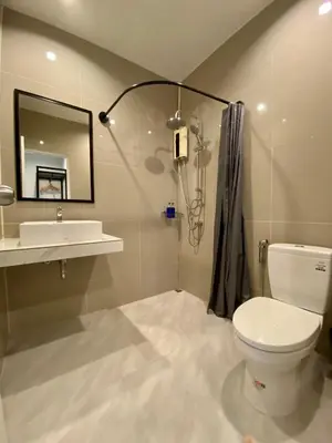 a bathroom with a toilet and a sink and a mirror at The dream garden in Ao Nang Beach