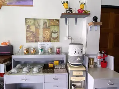 a toy kitchen with a table and a shelf at Remember at Phuket Town Hostel in Phuket Town