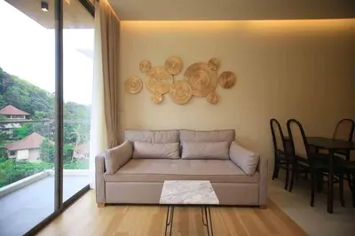 a living room with a couch and a table at Apartment in Aonang - great location with pool in Ao Nang Beach