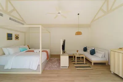 a bedroom with a bed and a tv and a couch at The Pin Boutique Pool Villa Krabi in Ao Nang Beach