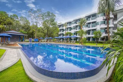 a large swimming pool in front of a building at Holiday Style Ao Nang Beach Resort, Krabi in Ao Nang Beach